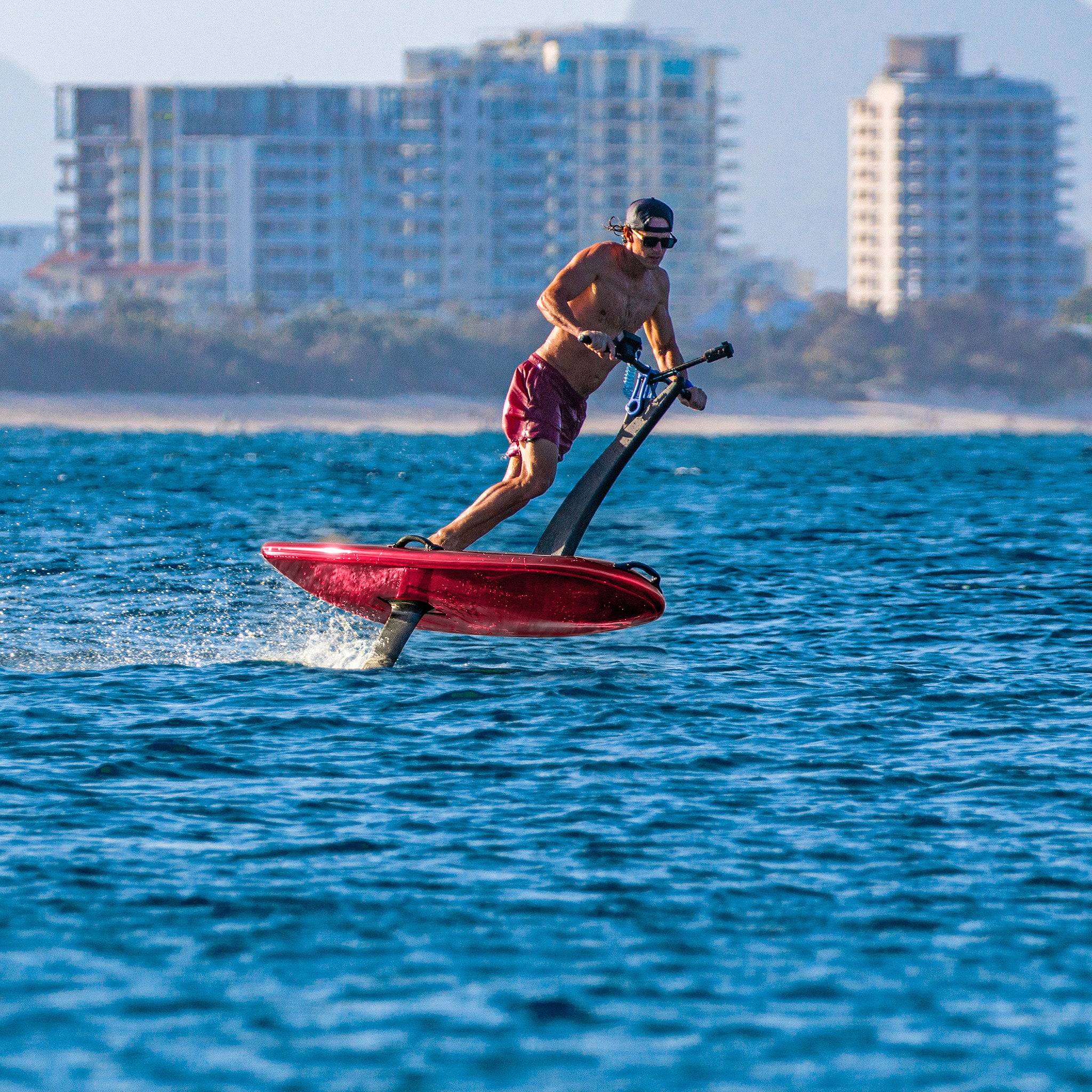 Hydroflyer rider on red Sport board