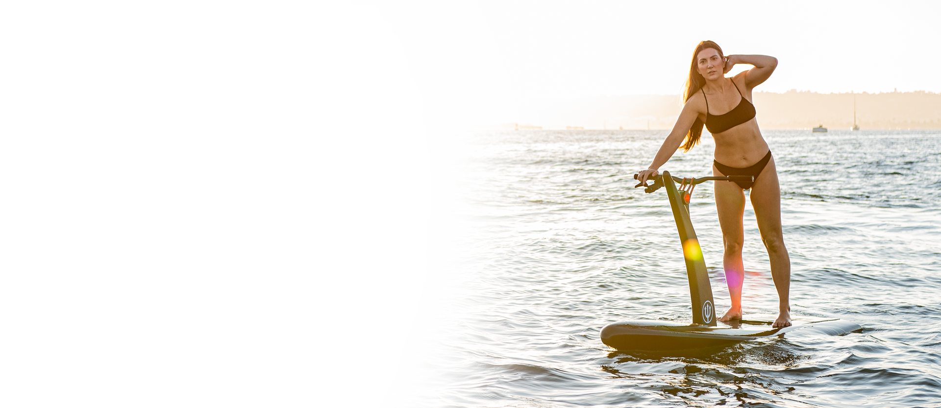 Woman riding Hydroflyer at sunset